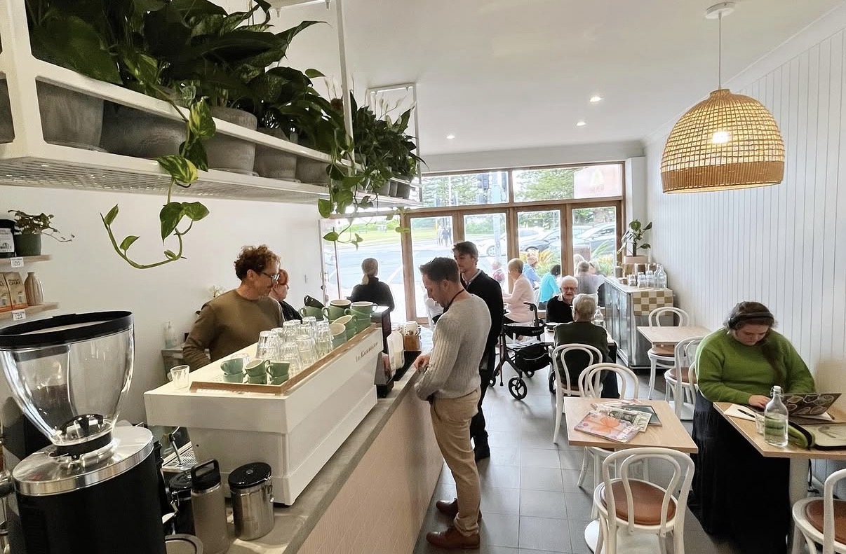The Peak Cafe interior with customers at the counter