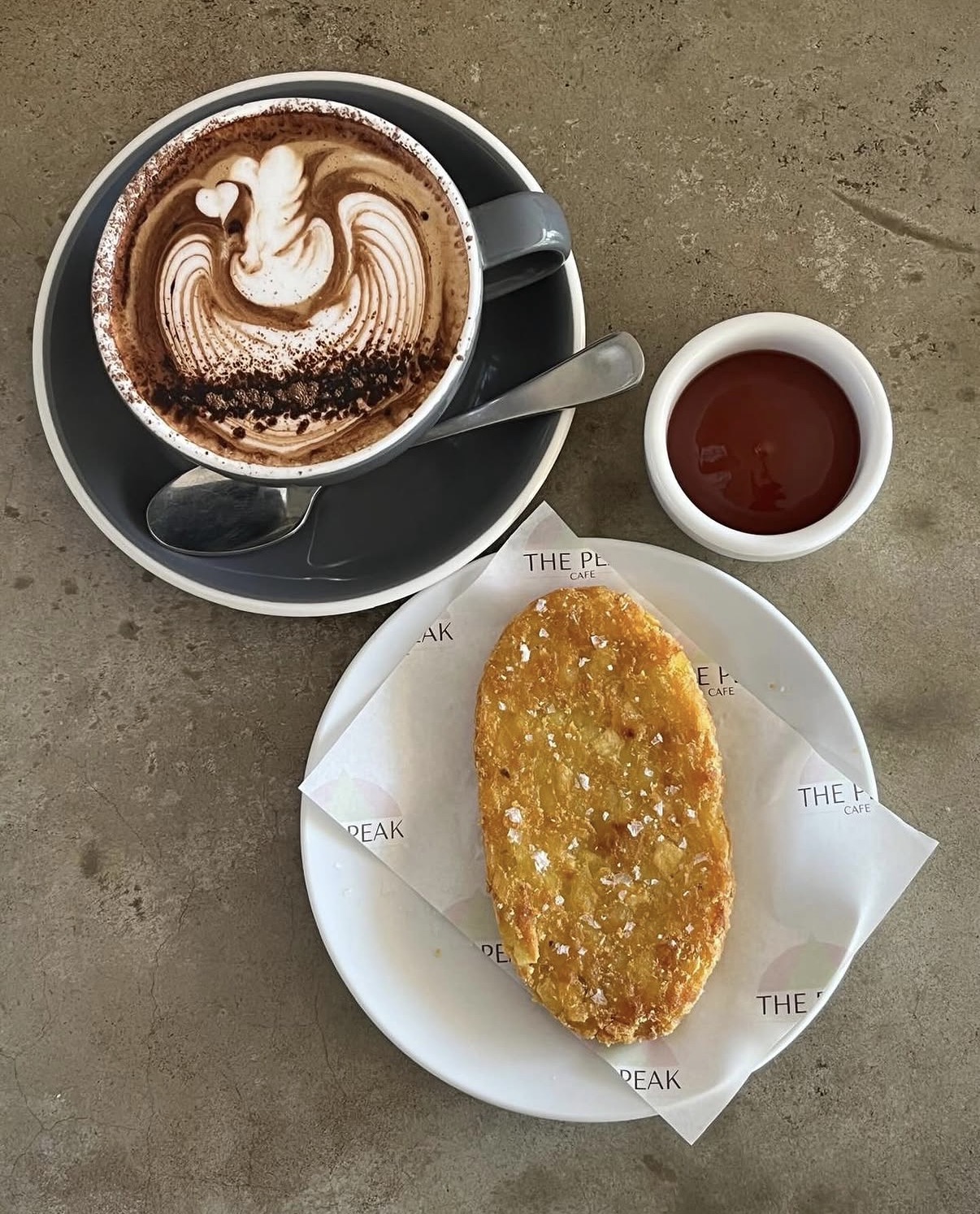 Golden hash brown with sea salt, tomato sauce and a hot chocolate